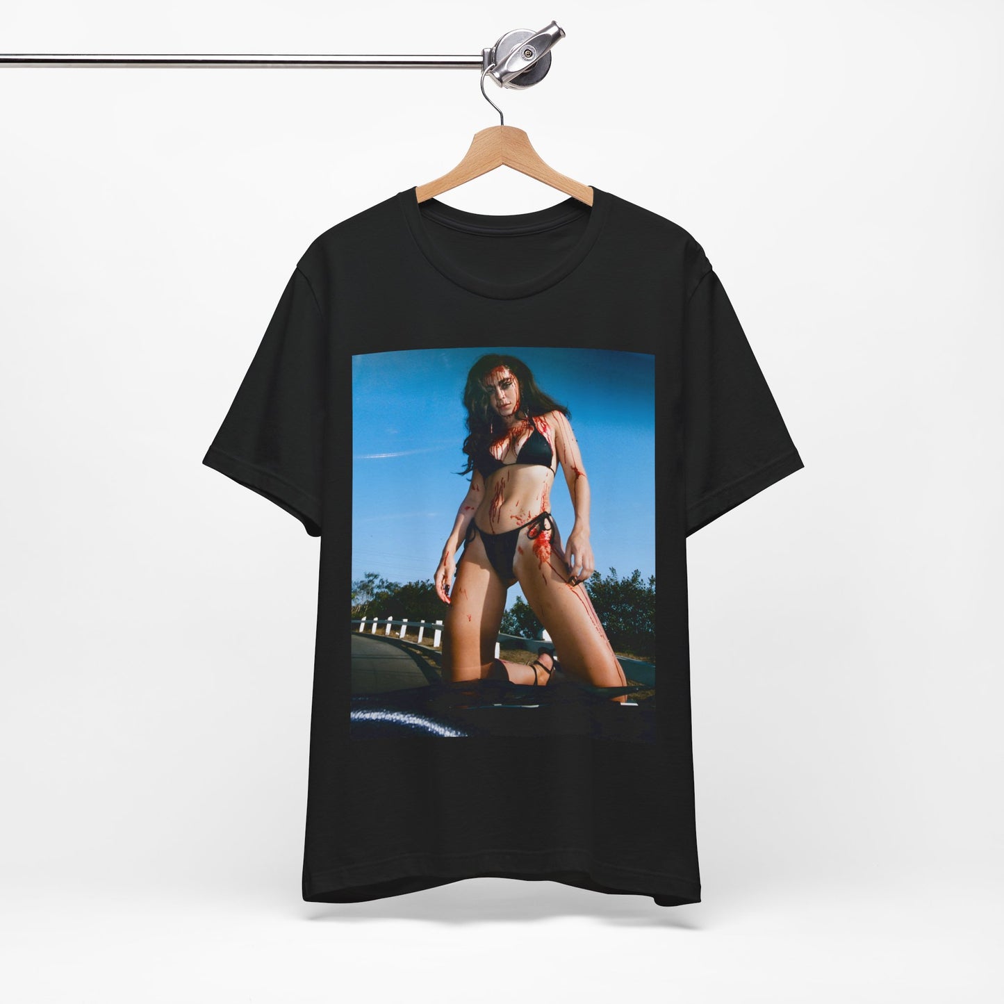 A black graphic t-shirt featuring the album cover art for Charli XCX's 'CRASH' album.