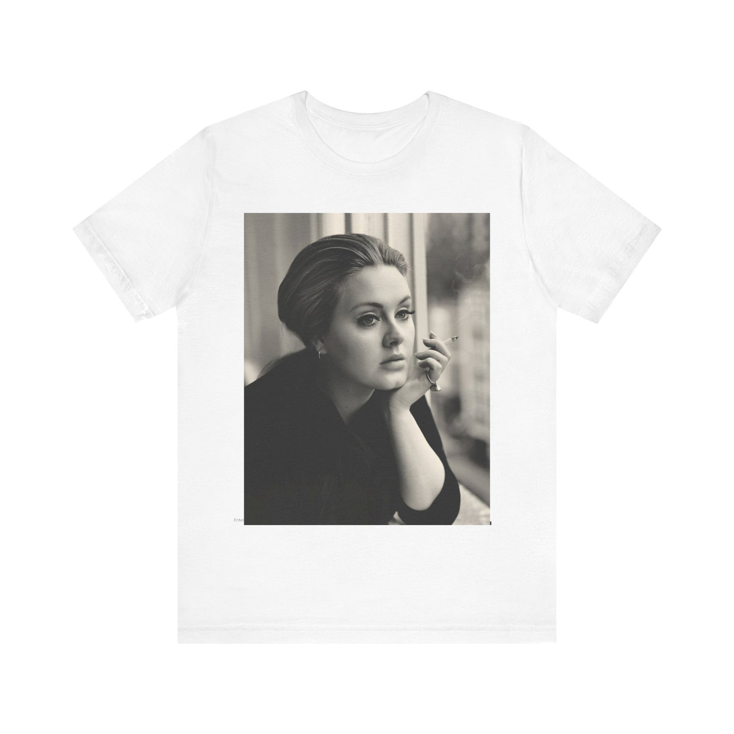 A black graphic t-shirt featuring a black and white photo of Adele, showing her with a serene or thoughtful expression.
