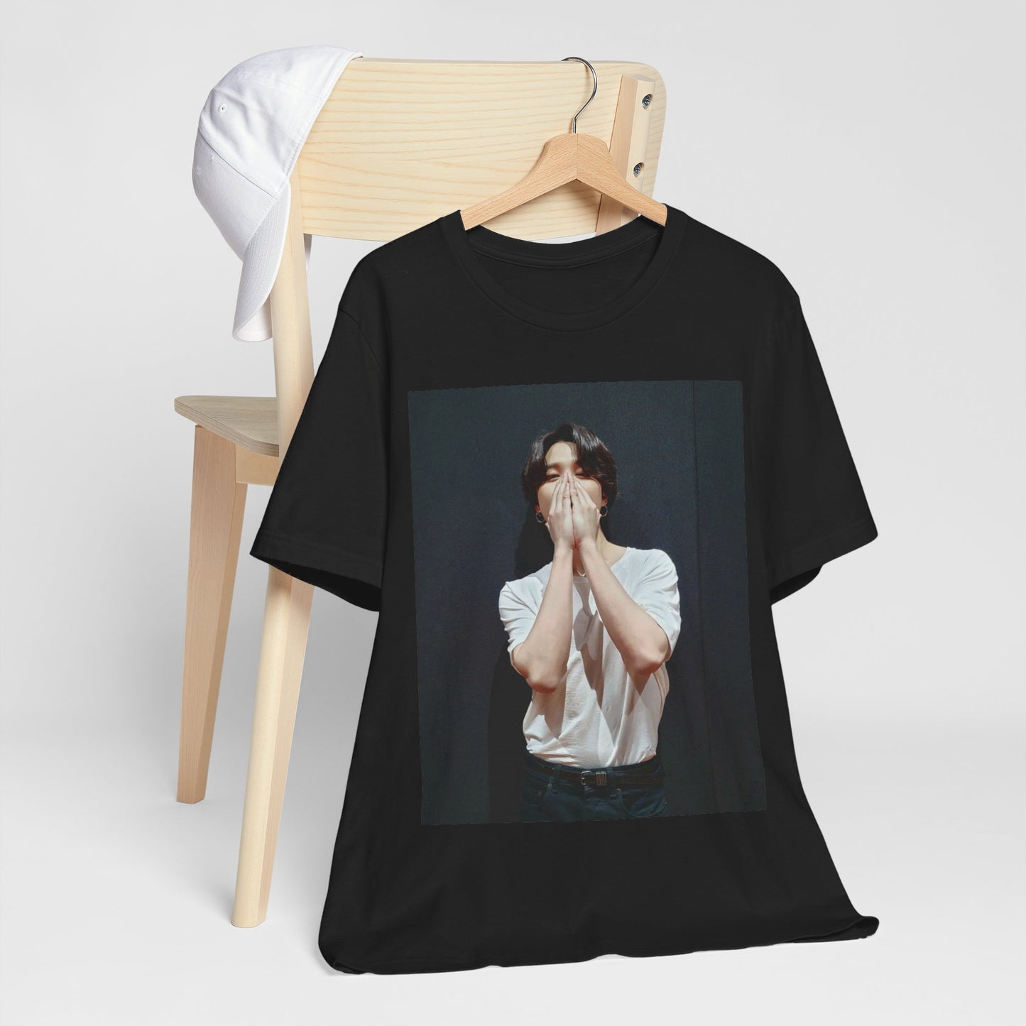 A black graphic t-shirt featuring a graphic of Jimin designed for everyday K-Pop style.