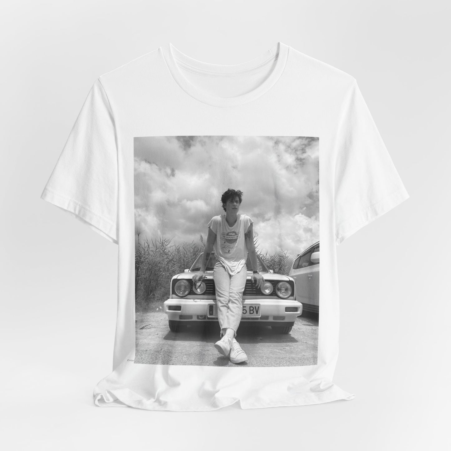 A black graphic t-shirt featuring a graphic of Shawn Mendes in an iconic tank top look.
