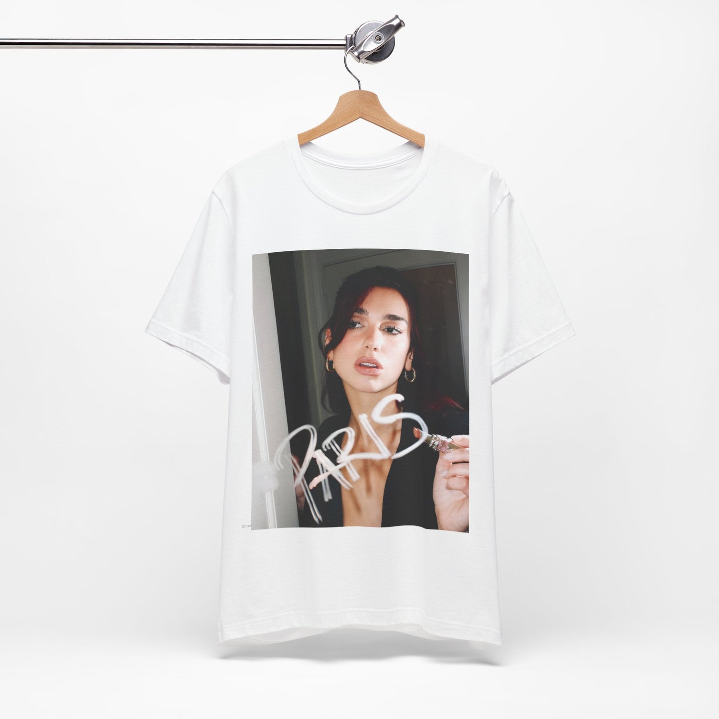 A black graphic t-shirt featuring a graphic of Dua Lipa, possibly with Parisian elements or a 'Paris' theme.