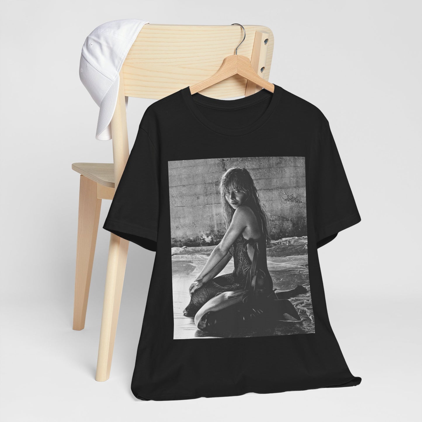 A black graphic t-shirt featuring a black and white, monochrome graphic or photo of Sabrina Carpenter.