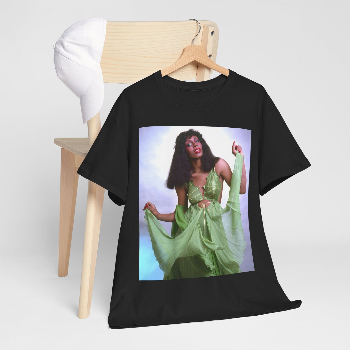 A black graphic t-shirt featuring an 80s pop icon aesthetic graphic of Donna Summer.