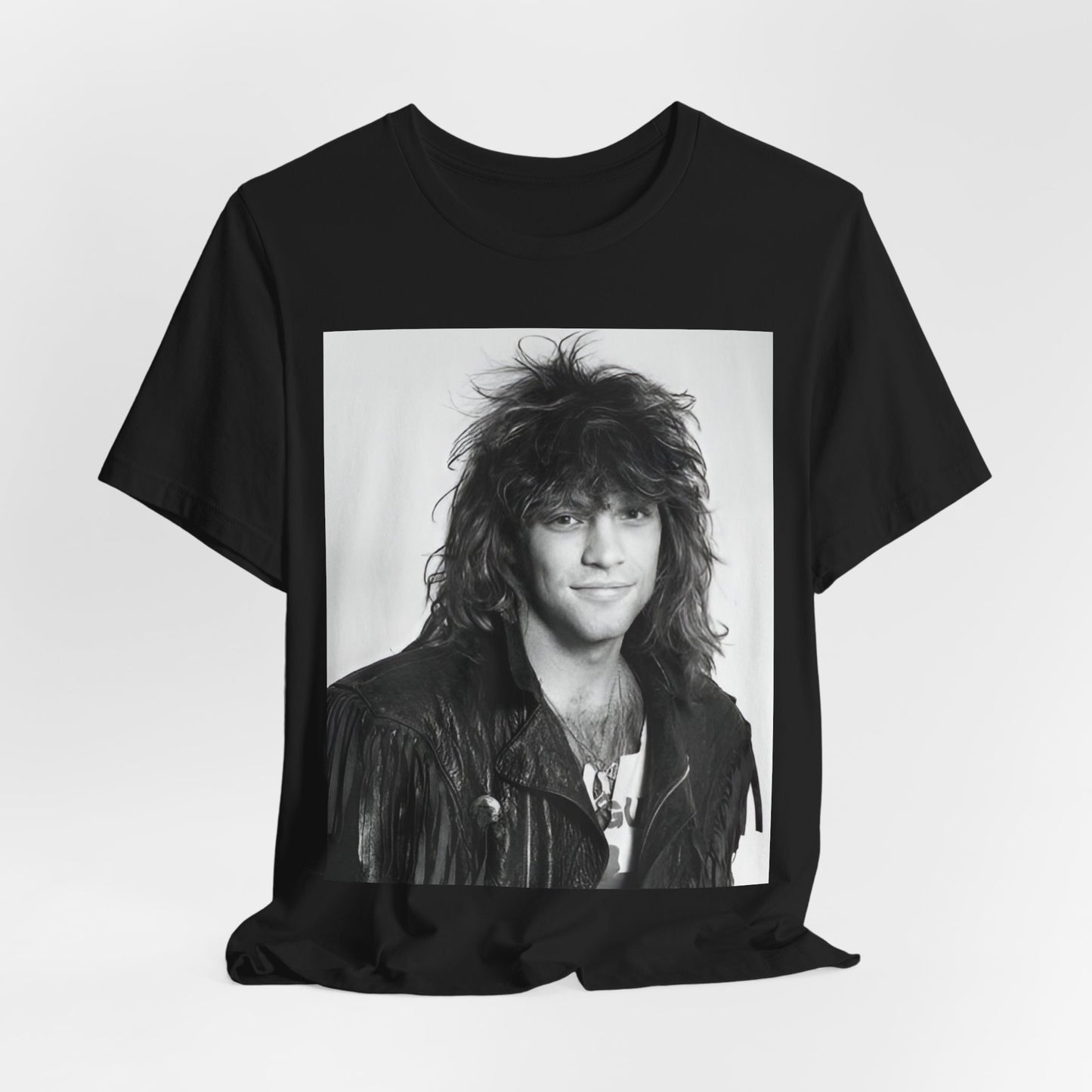 A black graphic t-shirt featuring a black and white photo of Bon Jovi from a 90s tour, performing on stage.