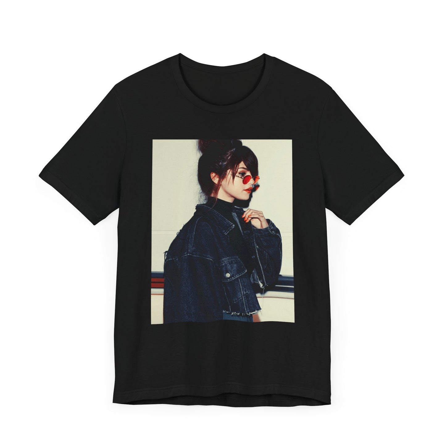 A black graphic t-shirt featuring a bold graphic of Selena Gomez as a pop superstar.