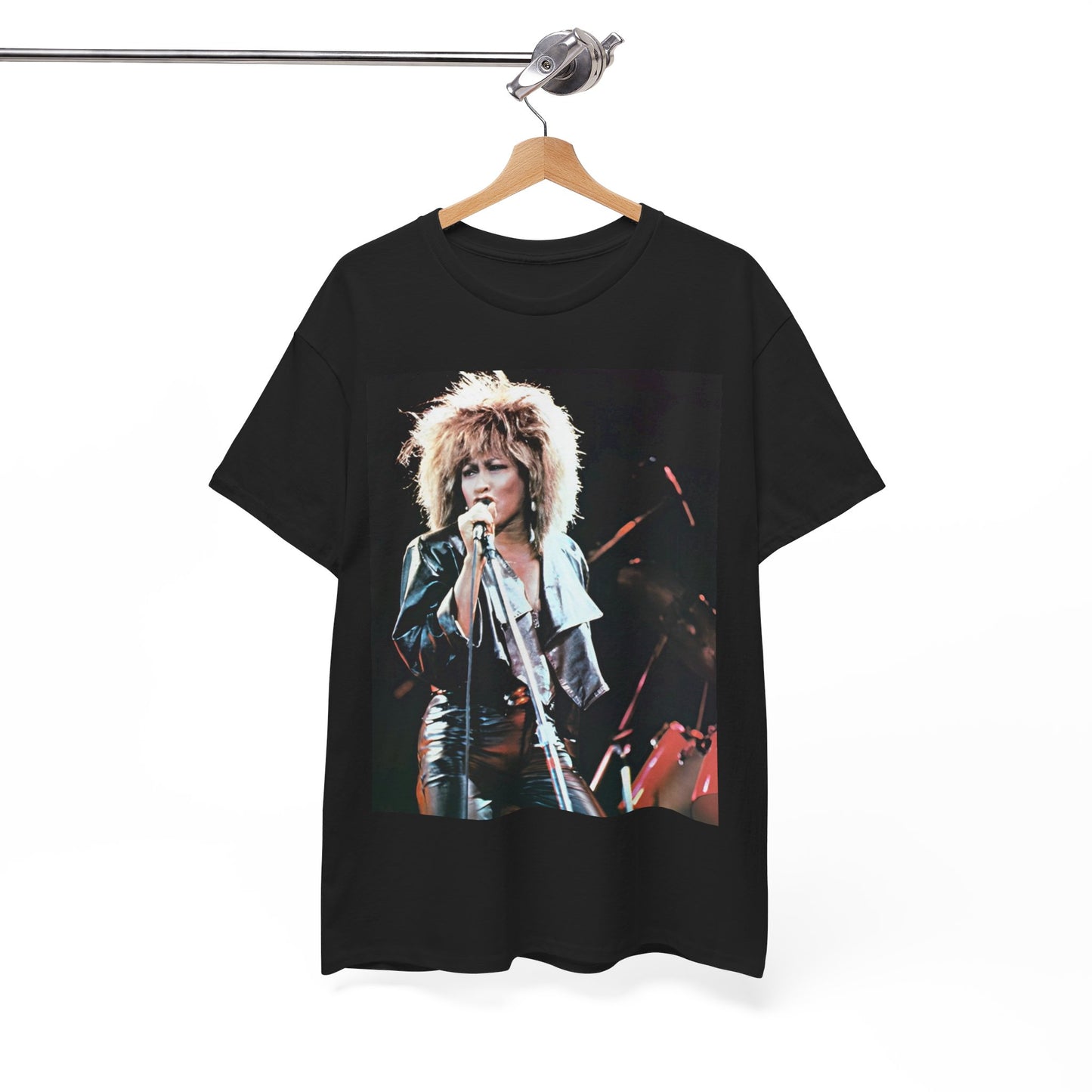 A black graphic t-shirt featuring a 90s graphic or photo of Tina Turner performing live on stage.