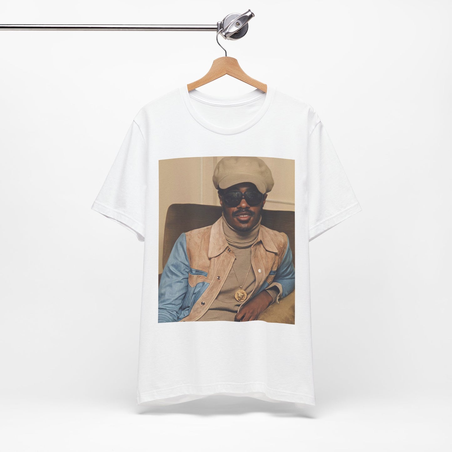 A black graphic t-shirt featuring a retro graphic related to Stevie Wonder's 'Songs in the Key of Life' album era.