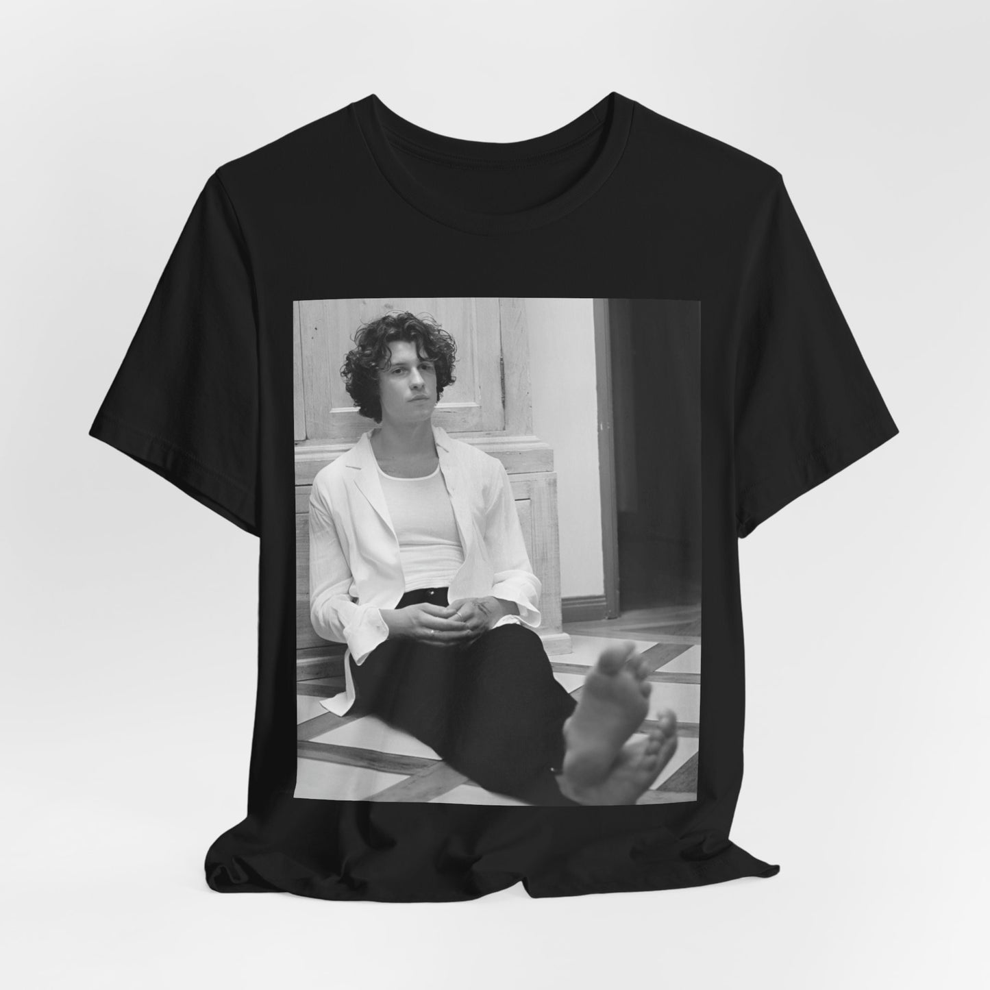 A black graphic t-shirt featuring a vintage casual style graphic of Shawn Mendes.