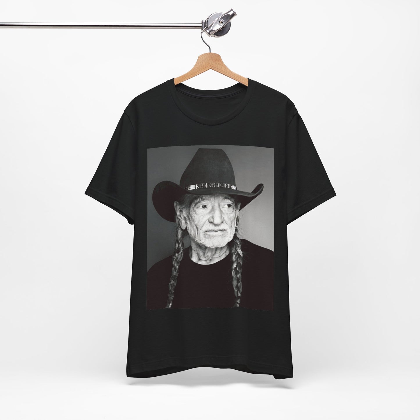 A black graphic t-shirt featuring a graphic of Willie Nelson with his iconic guitar 'Trigger'.