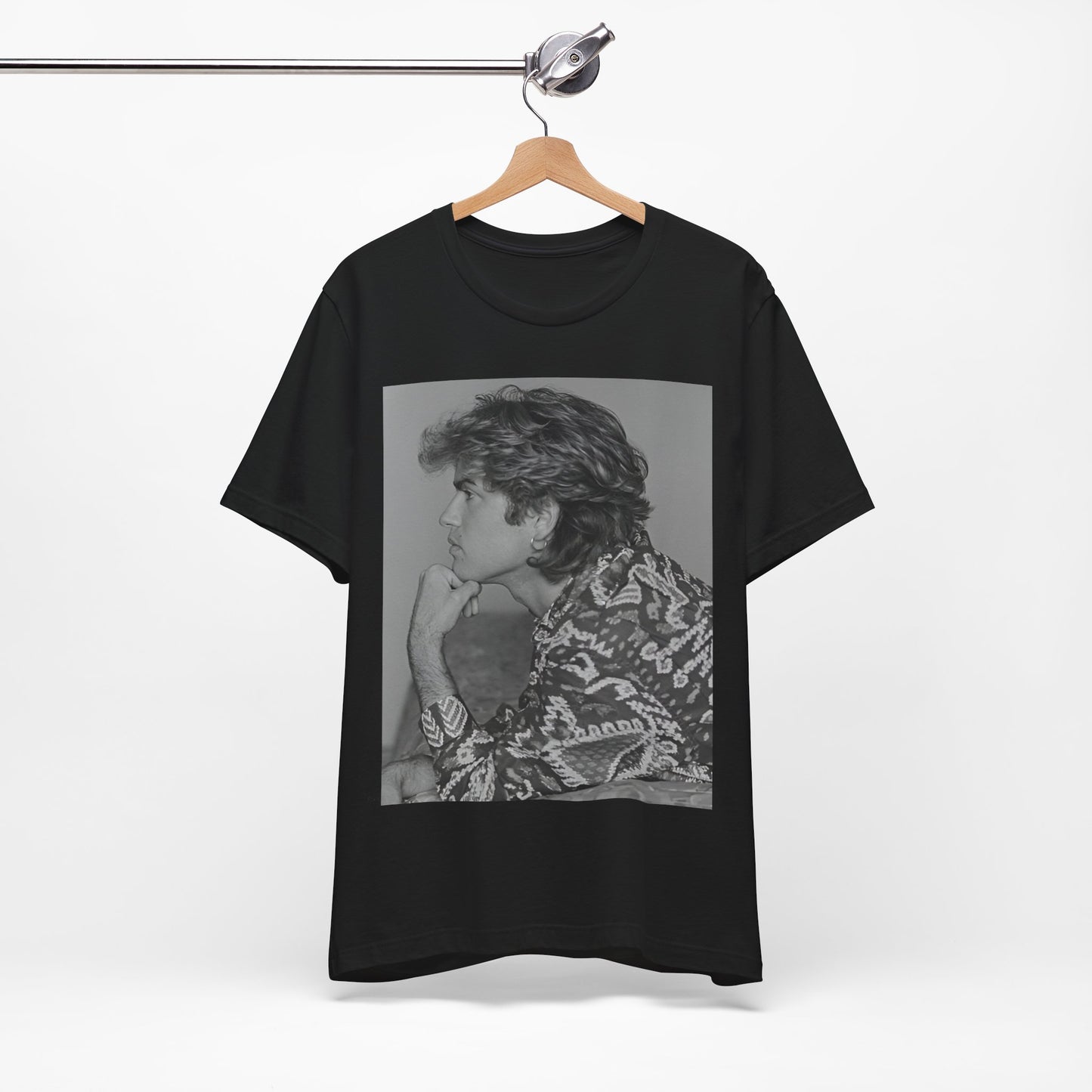 A black graphic t-shirt featuring a graphic of George Michael from his 80s Wham! era.