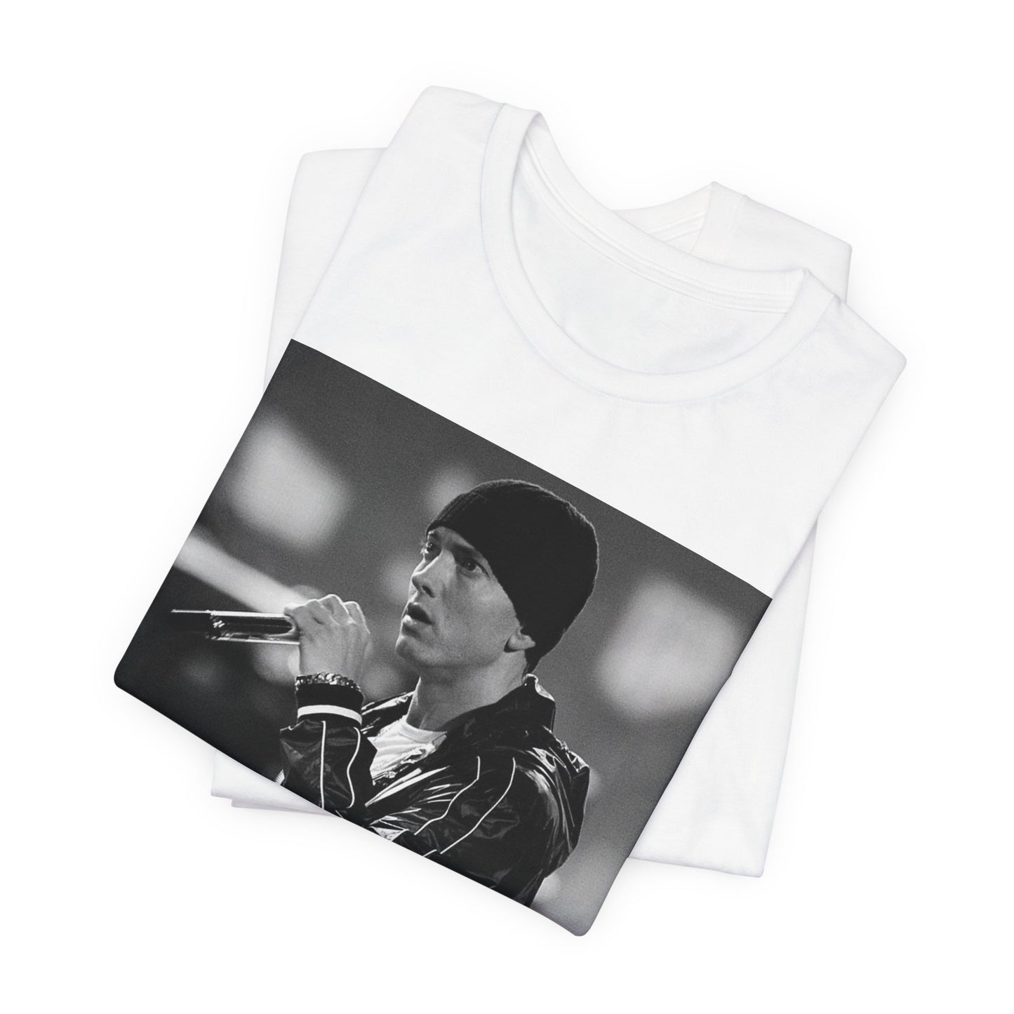 A black graphic t-shirt featuring a classic 90s graphic of Eminem as a 'Rap God'.
