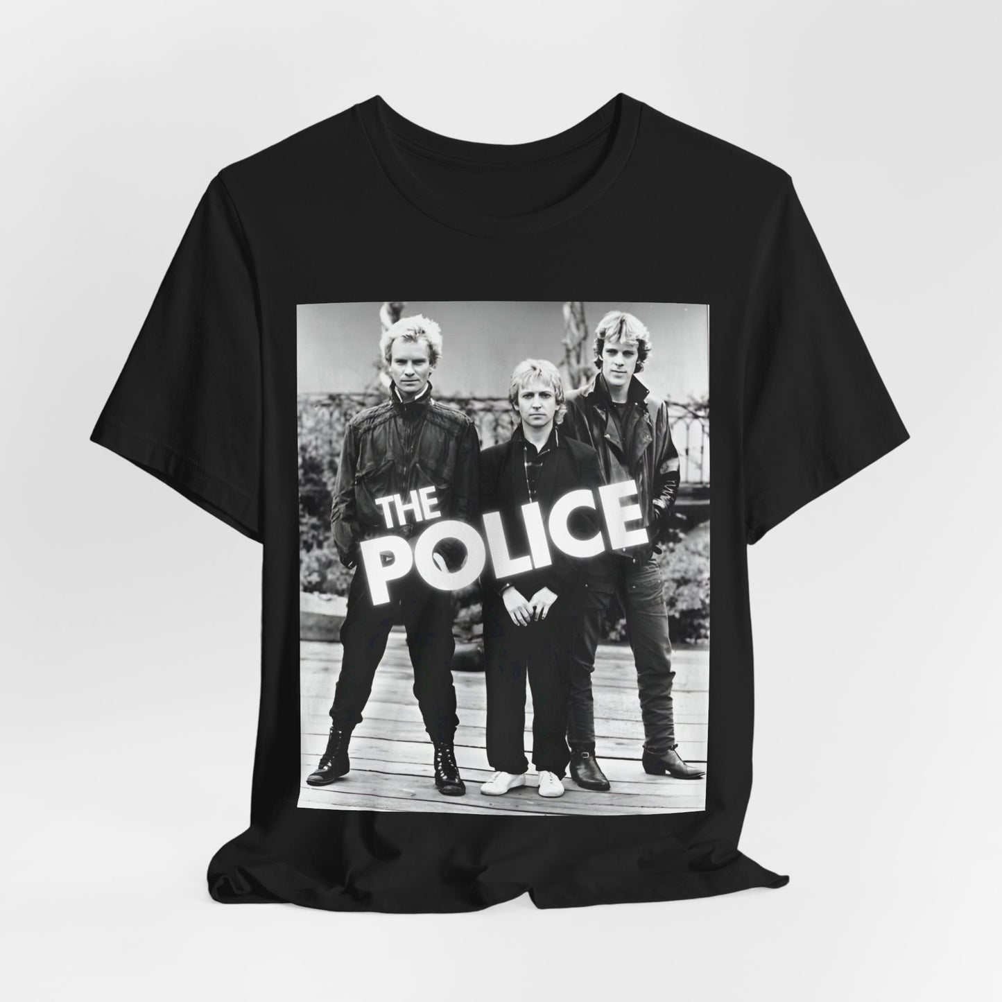 A black graphic t-shirt featuring an 80s pop rock aesthetic black and white graphic of The Police.