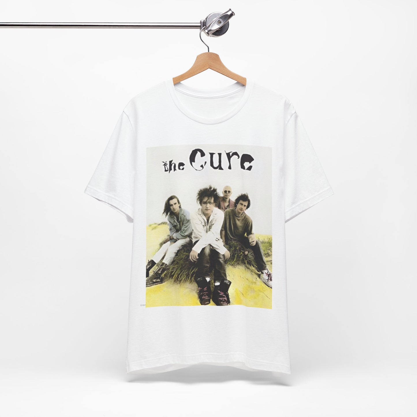 A black graphic t-shirt featuring a graphic of The Cure as post-punk pioneers.