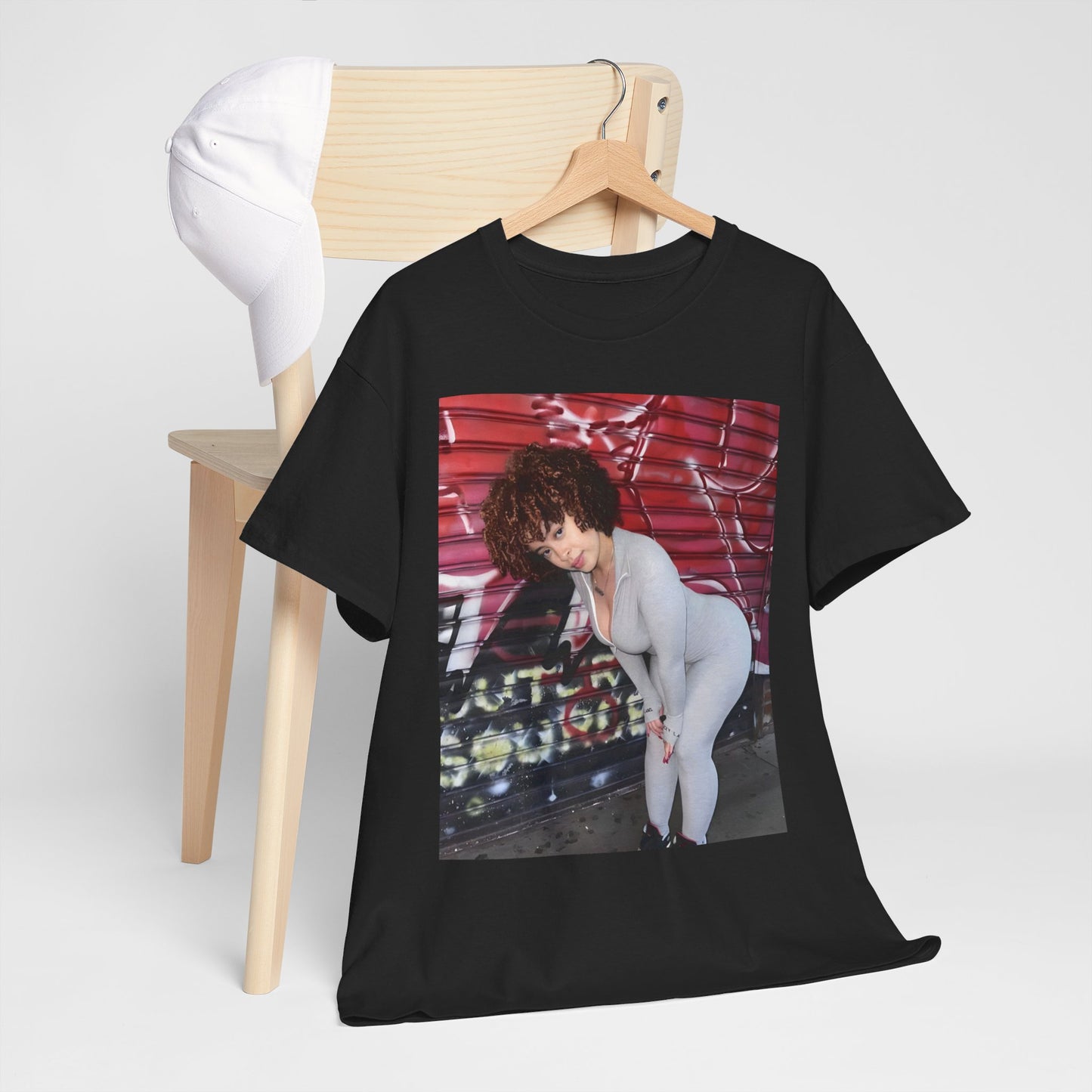 A black graphic t-shirt featuring a graphic of Ice Spice with text like 'No Flop Era'.
