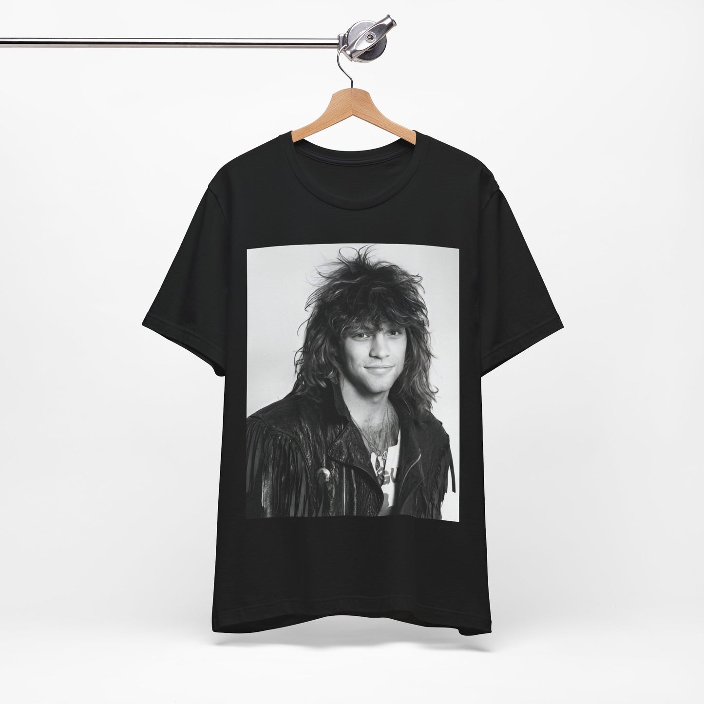 A black graphic t-shirt featuring a black and white photo of Bon Jovi from a 90s tour, performing on stage.