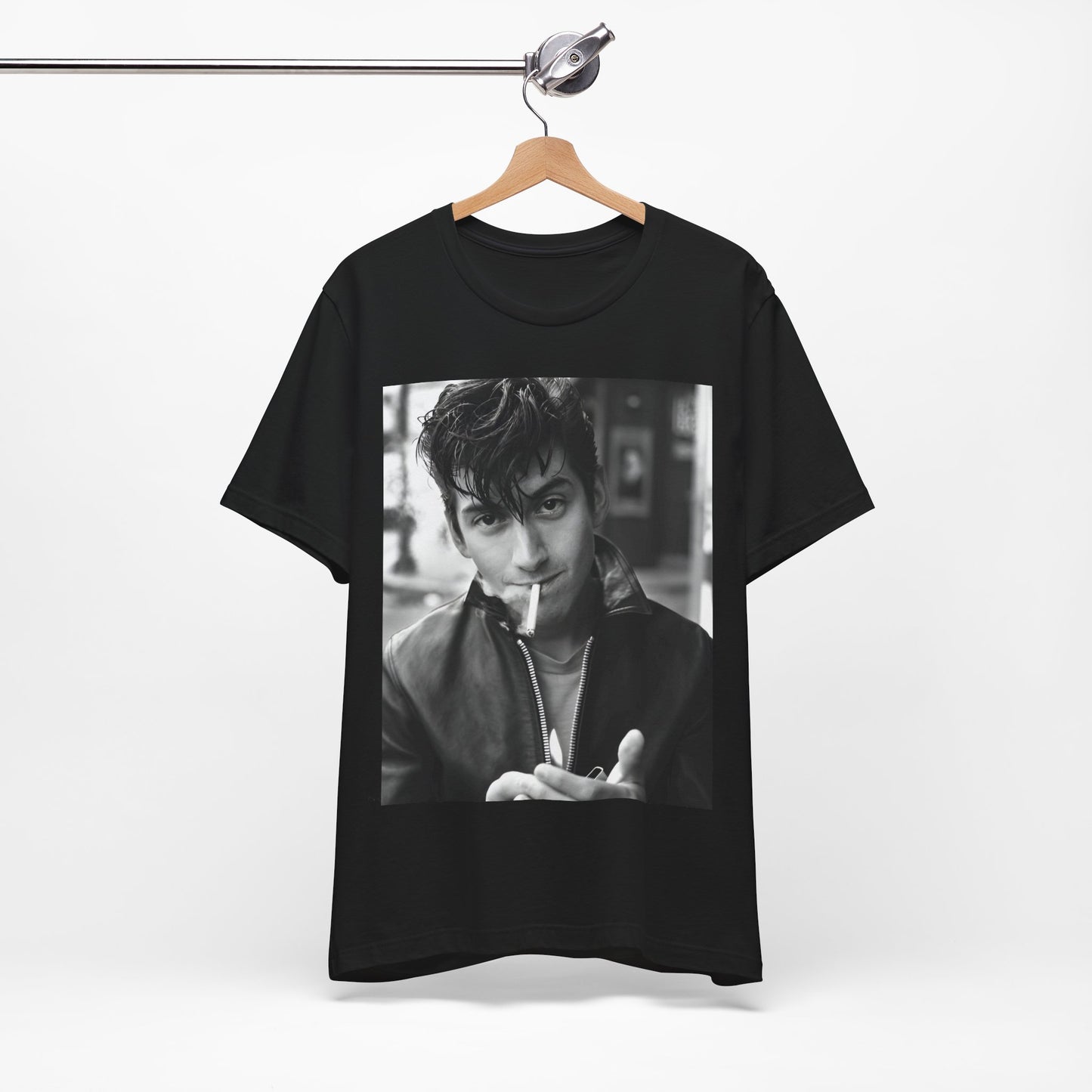 A black graphic t-shirt featuring a graphic of Alex Turner from Arctic Monkeys, in a rock star pose or setting.