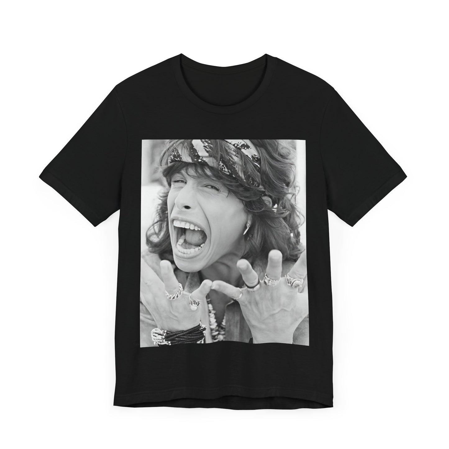 A black graphic t-shirt featuring a candid, dynamic photo of Aerosmith band members on tour in the 1970s, possibly showing action or interaction on stage or backstage.
