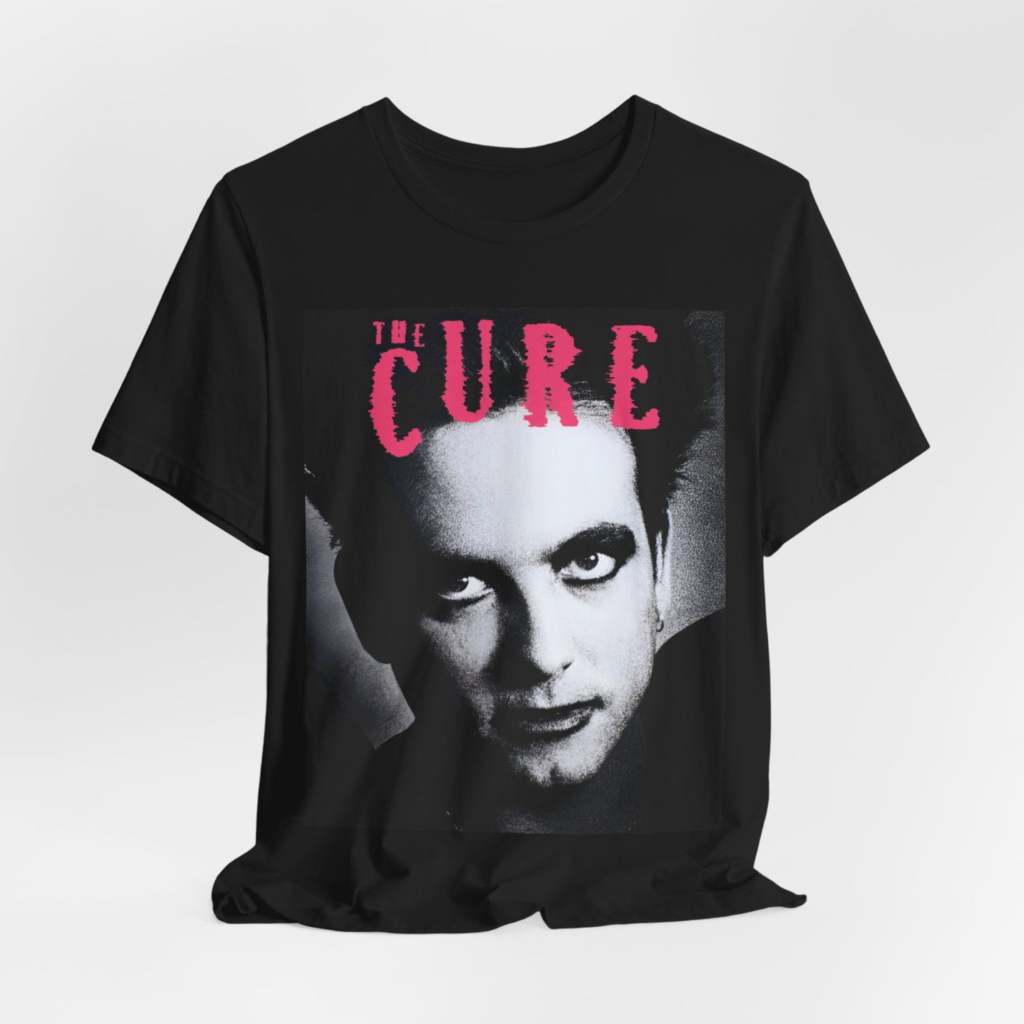 A black graphic t-shirt featuring an 80s post-punk aesthetic graphic of The Cure.