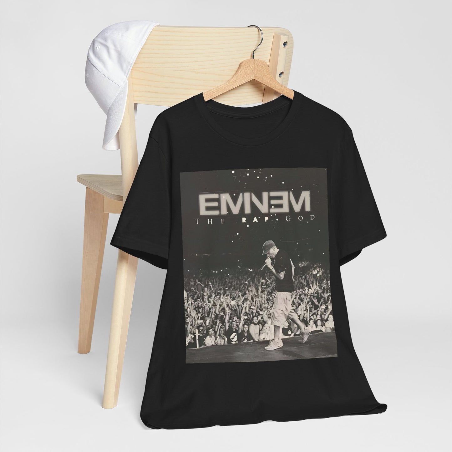A black graphic t-shirt featuring a graphic or photo of Eminem performing live on tour.