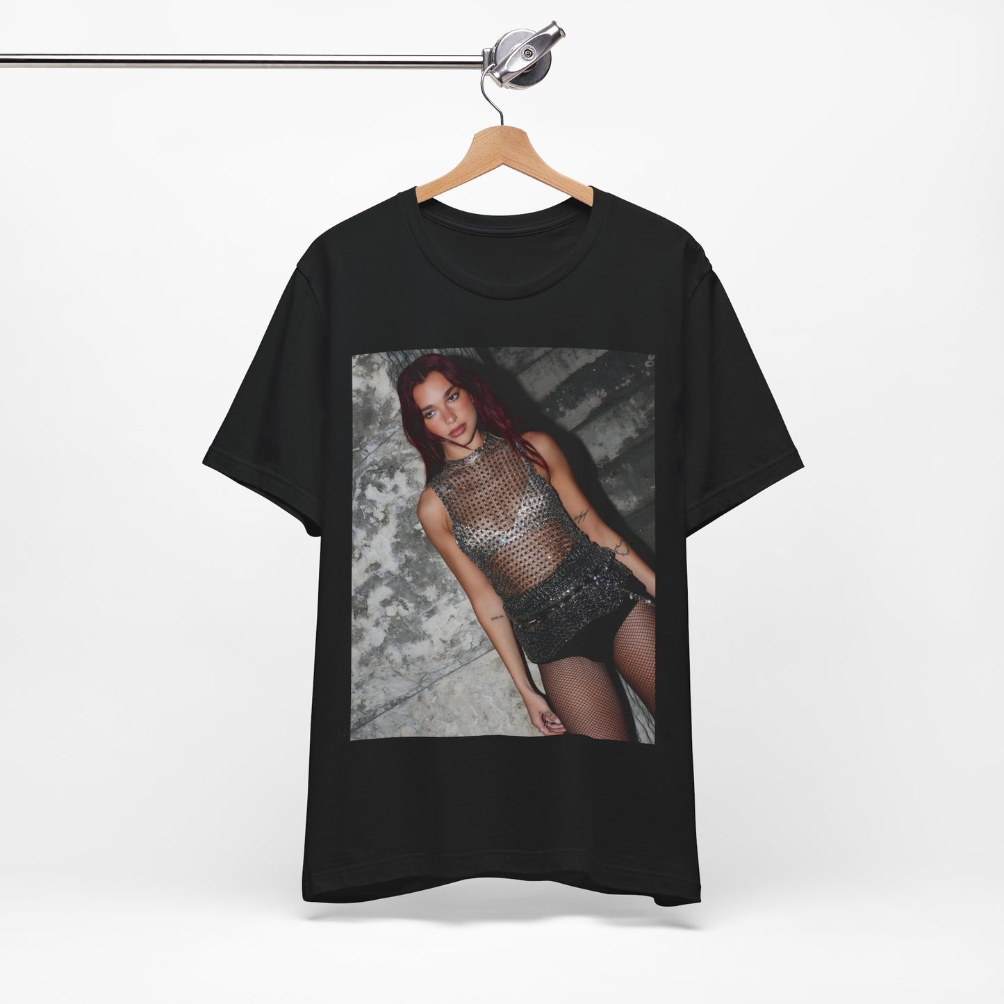 A black graphic t-shirt featuring a graphic of Dua Lipa as a disco queen, with an aesthetic design.
