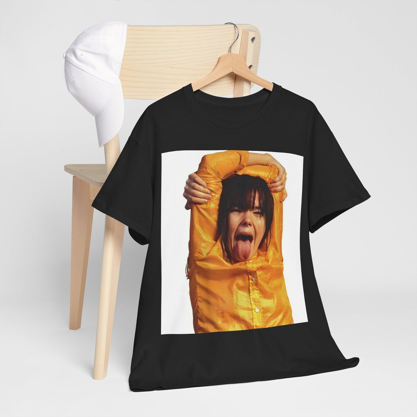 A black graphic t-shirt featuring a photo of Bjork with her tongue playfully sticking out.