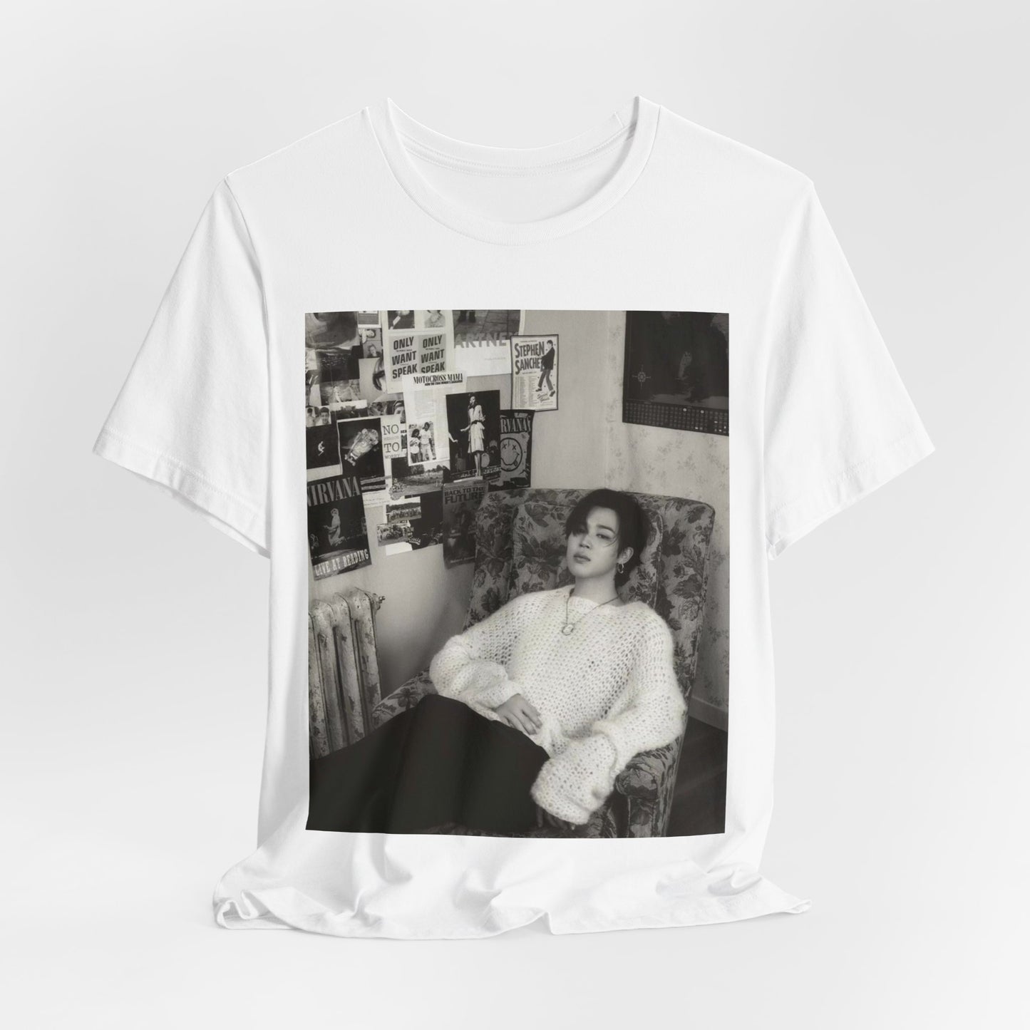 A black graphic t-shirt featuring a black and white portrait photo of Jimin.