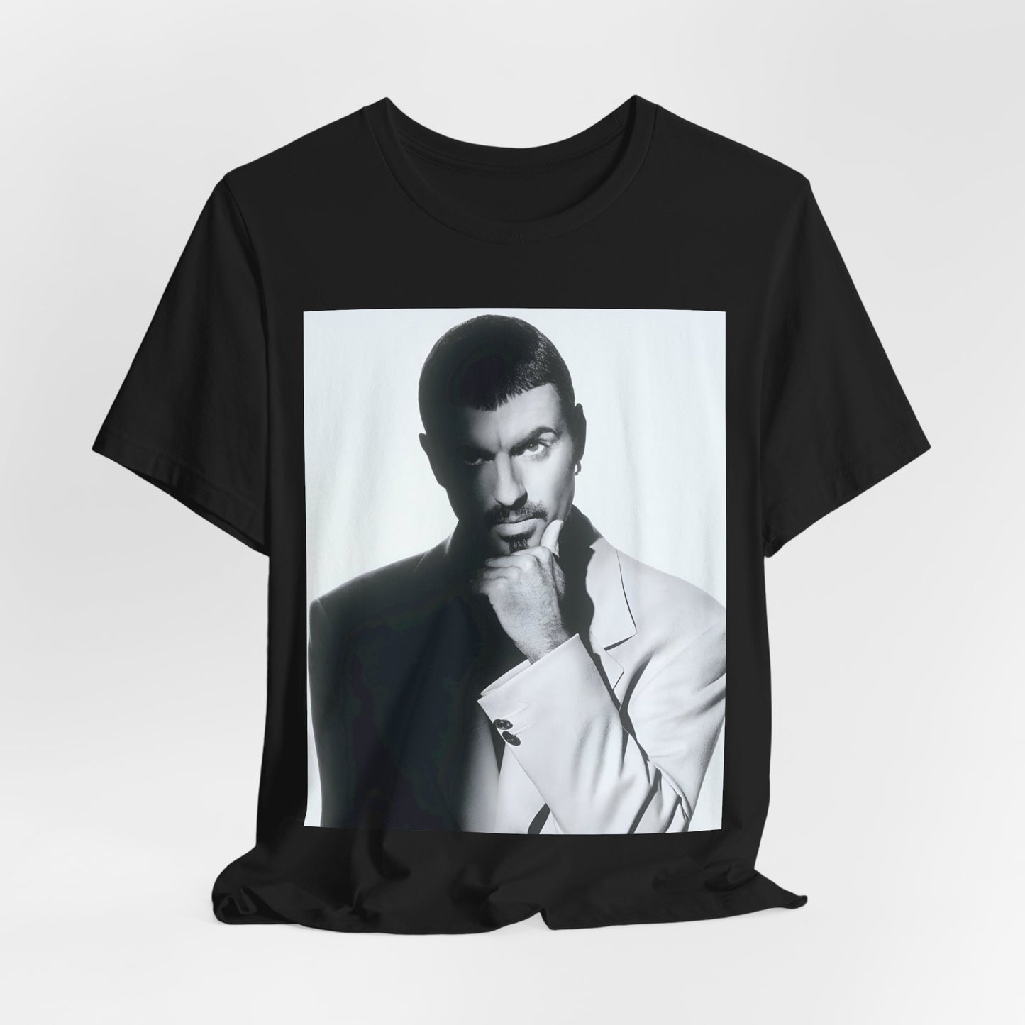 A black graphic t-shirt featuring a 90s aesthetic graphic of George Michael.