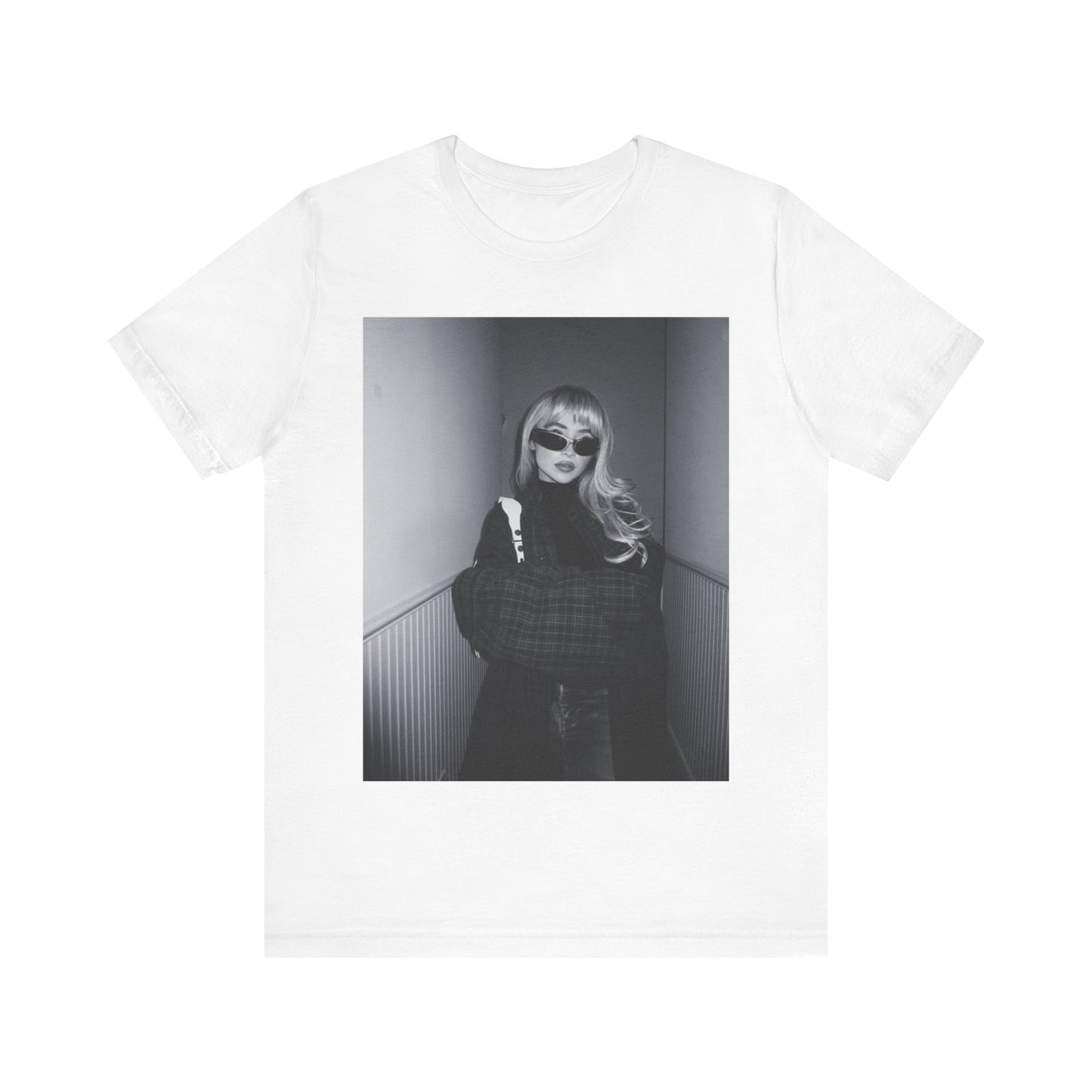 A black graphic t-shirt featuring a black and white glam pop diva graphic of Sabrina Carpenter.