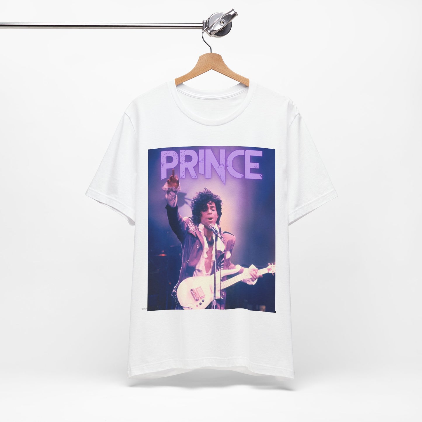 A black graphic t-shirt featuring a retro graphic related to Prince's 'Purple Rain' album era.