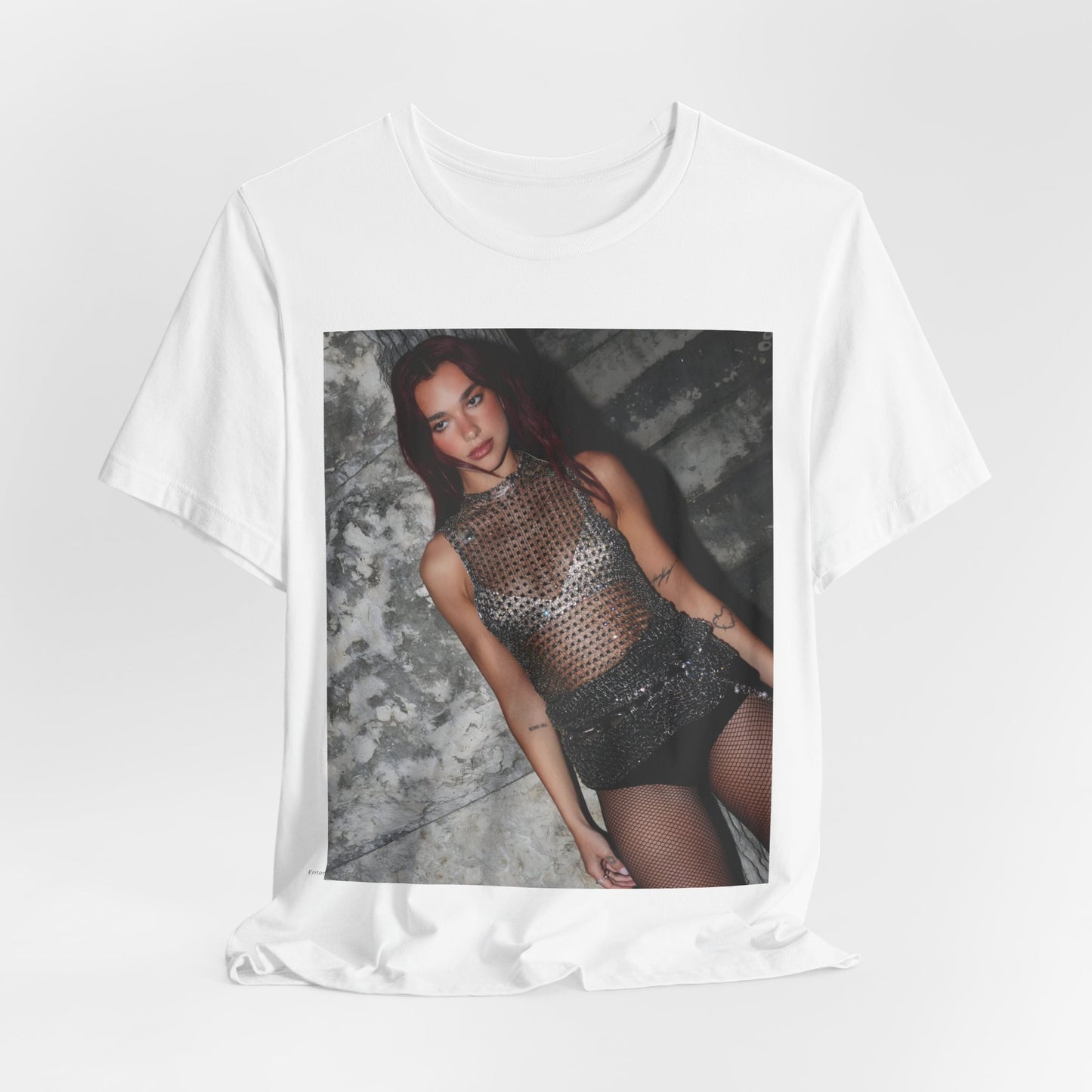A black graphic t-shirt featuring a graphic of Dua Lipa as a disco queen, with an aesthetic design.