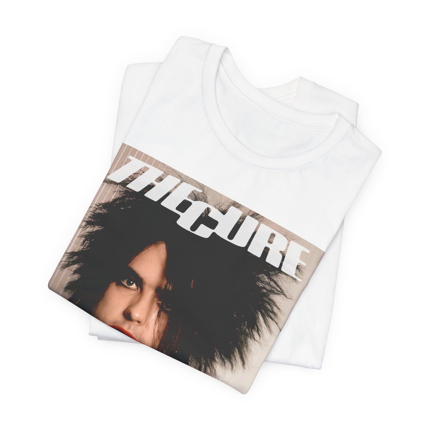 A black graphic t-shirt featuring a 90s portrait photo of Robert Smith from The Cure.