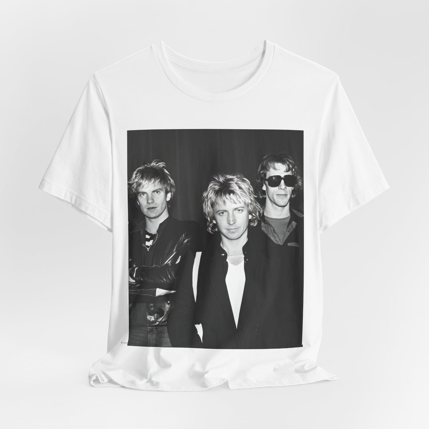 A black graphic t-shirt featuring a black and white, monochrome graphic or photo of The Police.