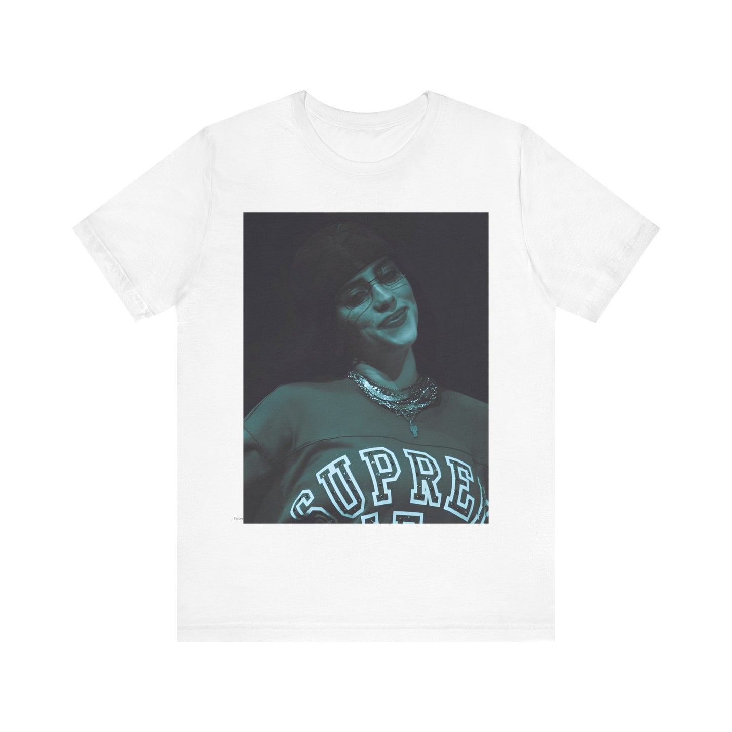 A powerful, close-up portrait of Billie Eilish with a direct and intense stare, printed on a graphic t-shirt.