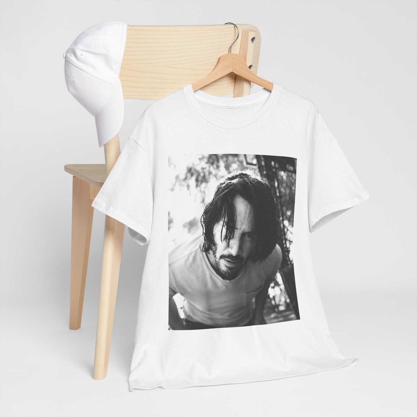 A black graphic t-shirt featuring a graphic of Keanu Reeves with authentic chill vibes.