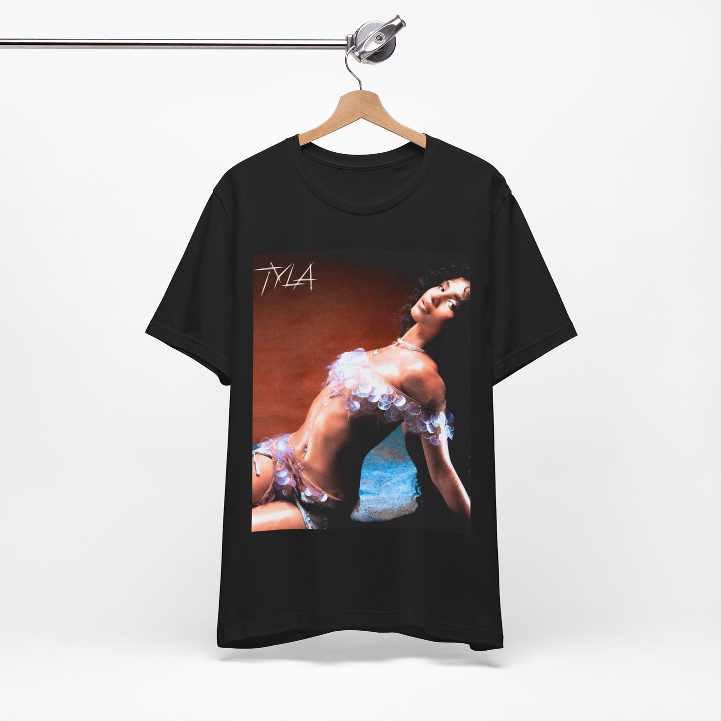 A black graphic t-shirt featuring a cultural fusion vibes graphic of Tyla.