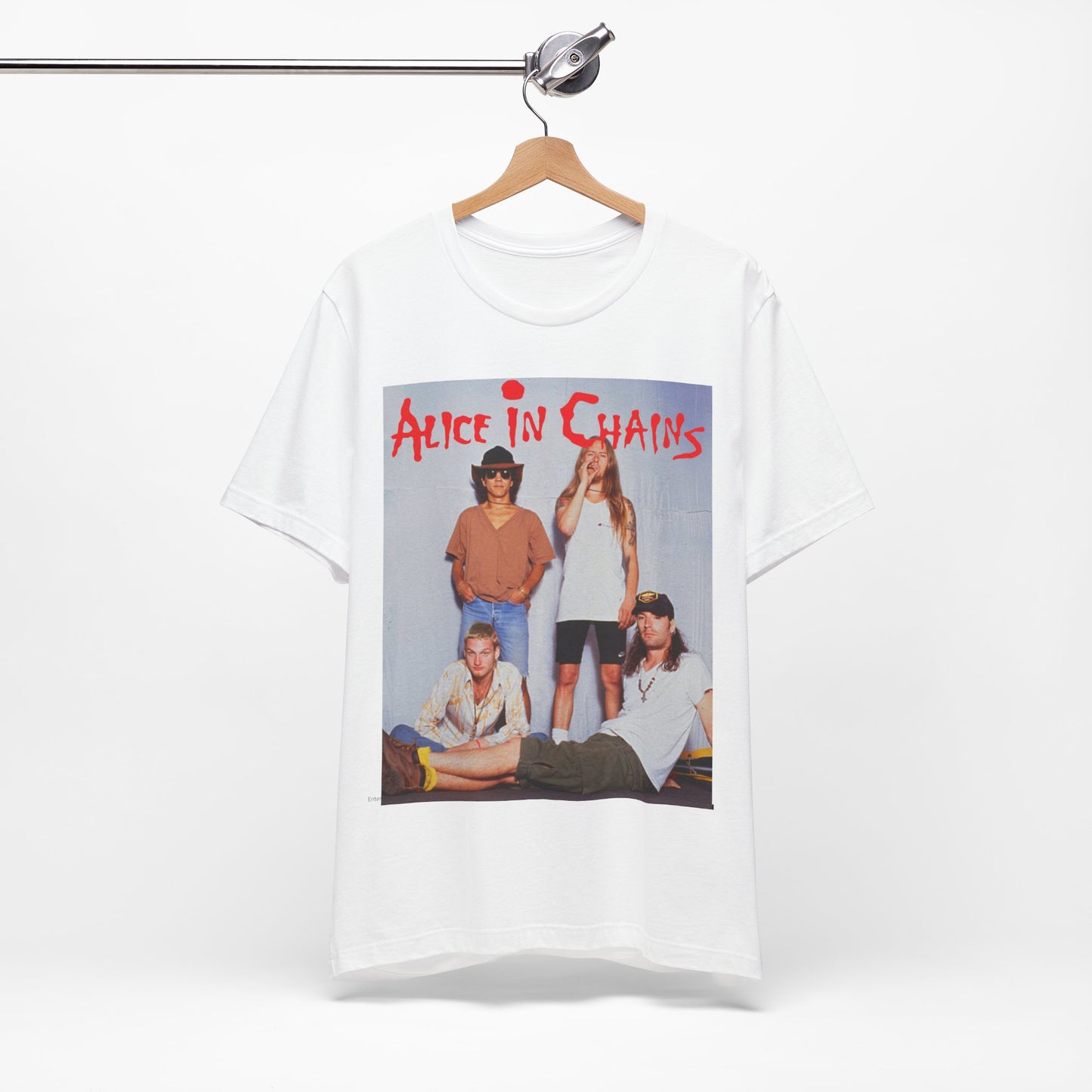 A black graphic t-shirt featuring a band graphic of Alice In Chains from 1990, capturing their early grunge aesthetic.