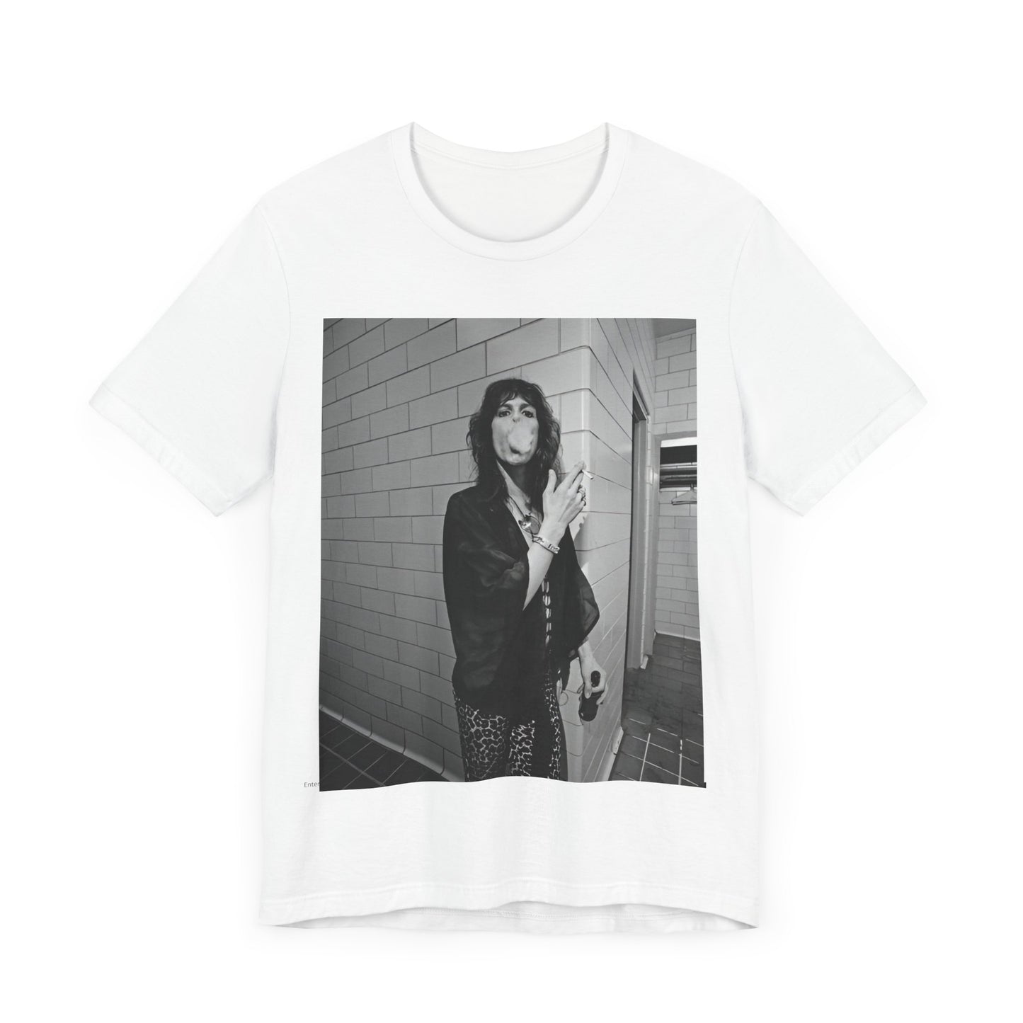 A black graphic t-shirt featuring a retro 70s photo of Aerosmith band members in a backstage setting, showing a candid moment.