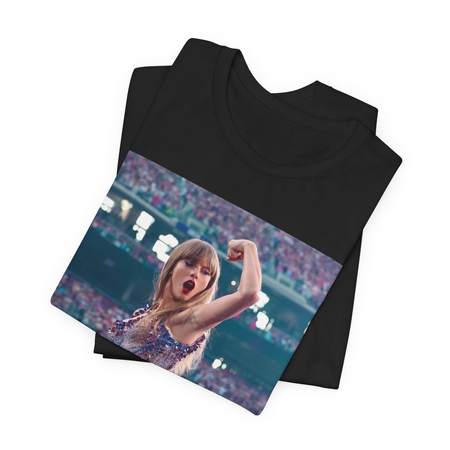 A black graphic t-shirt featuring a graphic or photo of Taylor Swift performing live on stage.