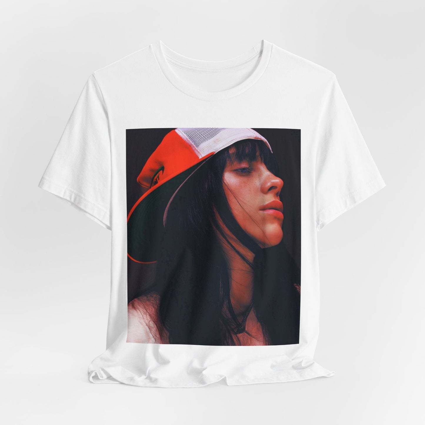 A graphic t-shirt featuring the name 'Billie Eilish' in a raw, urban street-style font.