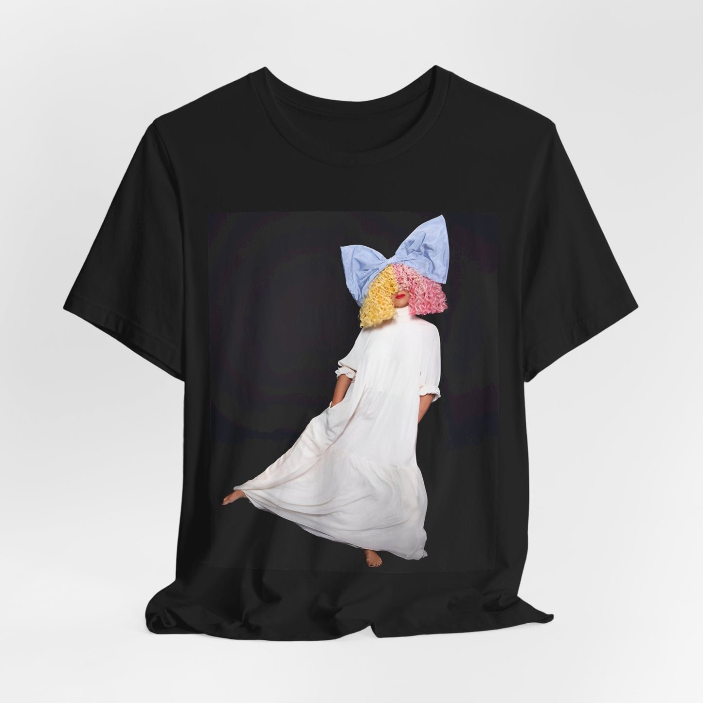 A black graphic t-shirt featuring a vintage pop icon graphic of Sia.