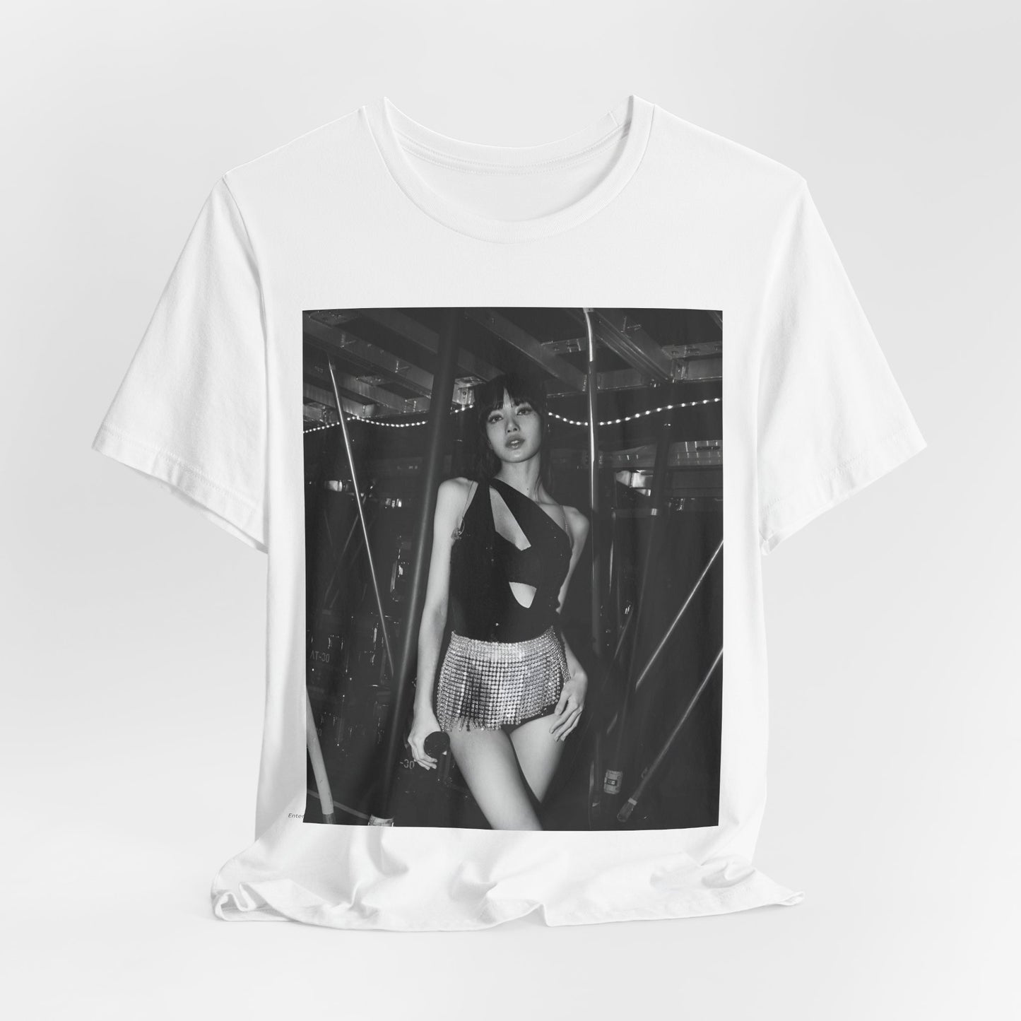 A black graphic t-shirt featuring a black and white graphic or photo of Lisa in a backstage setting.
