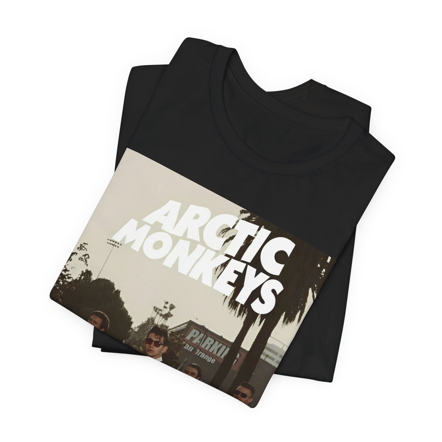 A black graphic t-shirt featuring Arctic Monkeys in a pose or setting similar to the iconic 'Abbey Road' album cover.