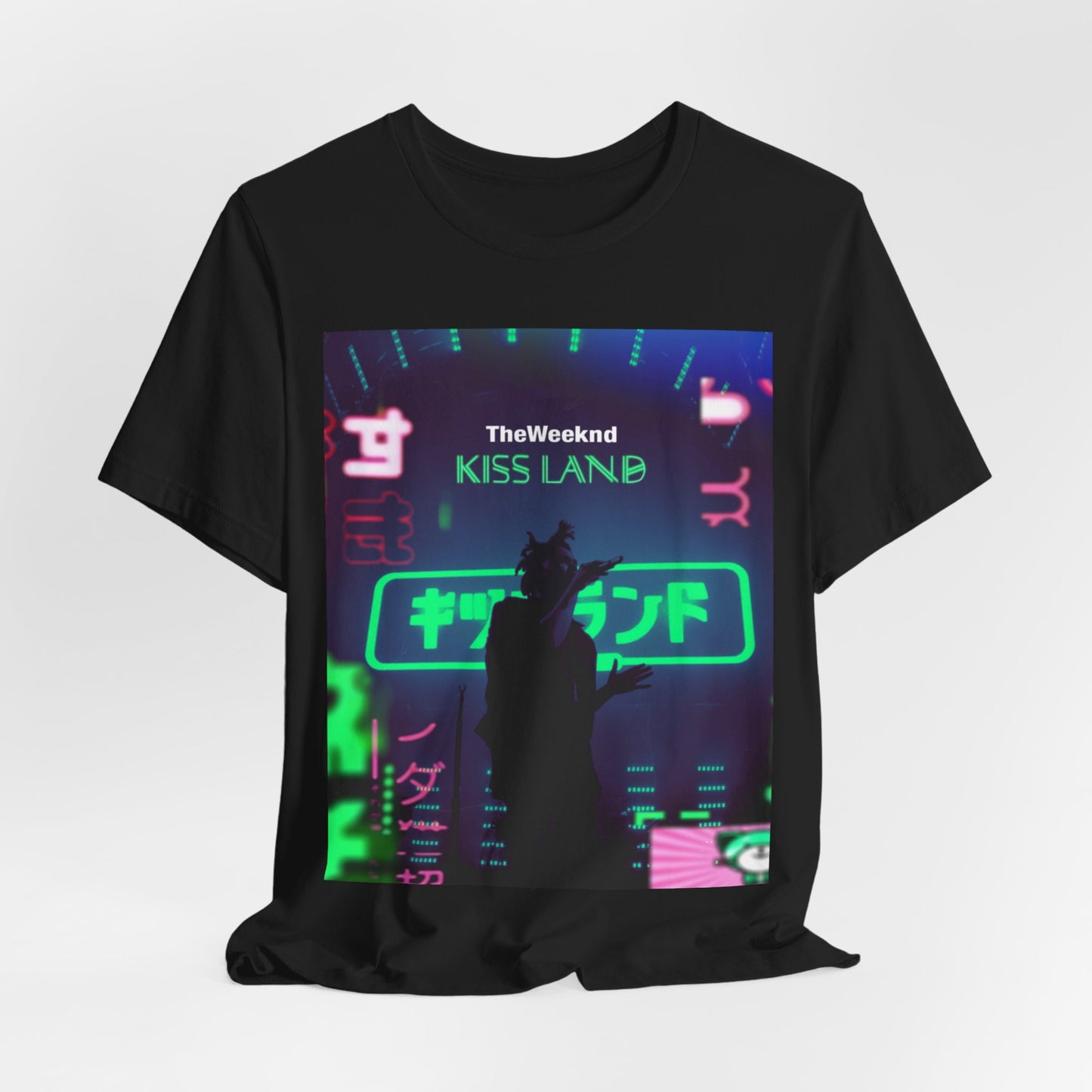 A black graphic t-shirt featuring a graphic related to The Weeknd's 'Kiss Land' live performances.