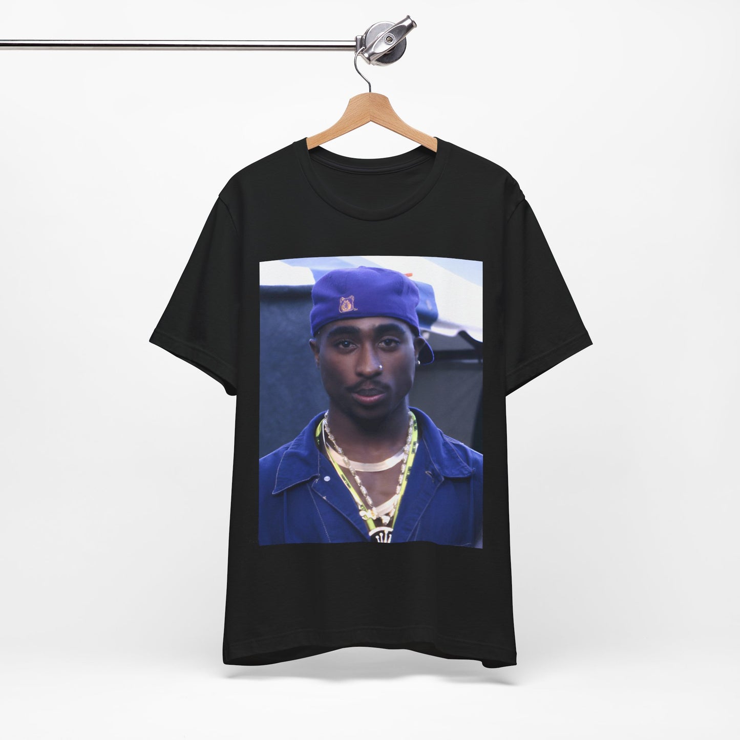 A black graphic t-shirt featuring a graphic related to Tupac's 'California Love' song or era.