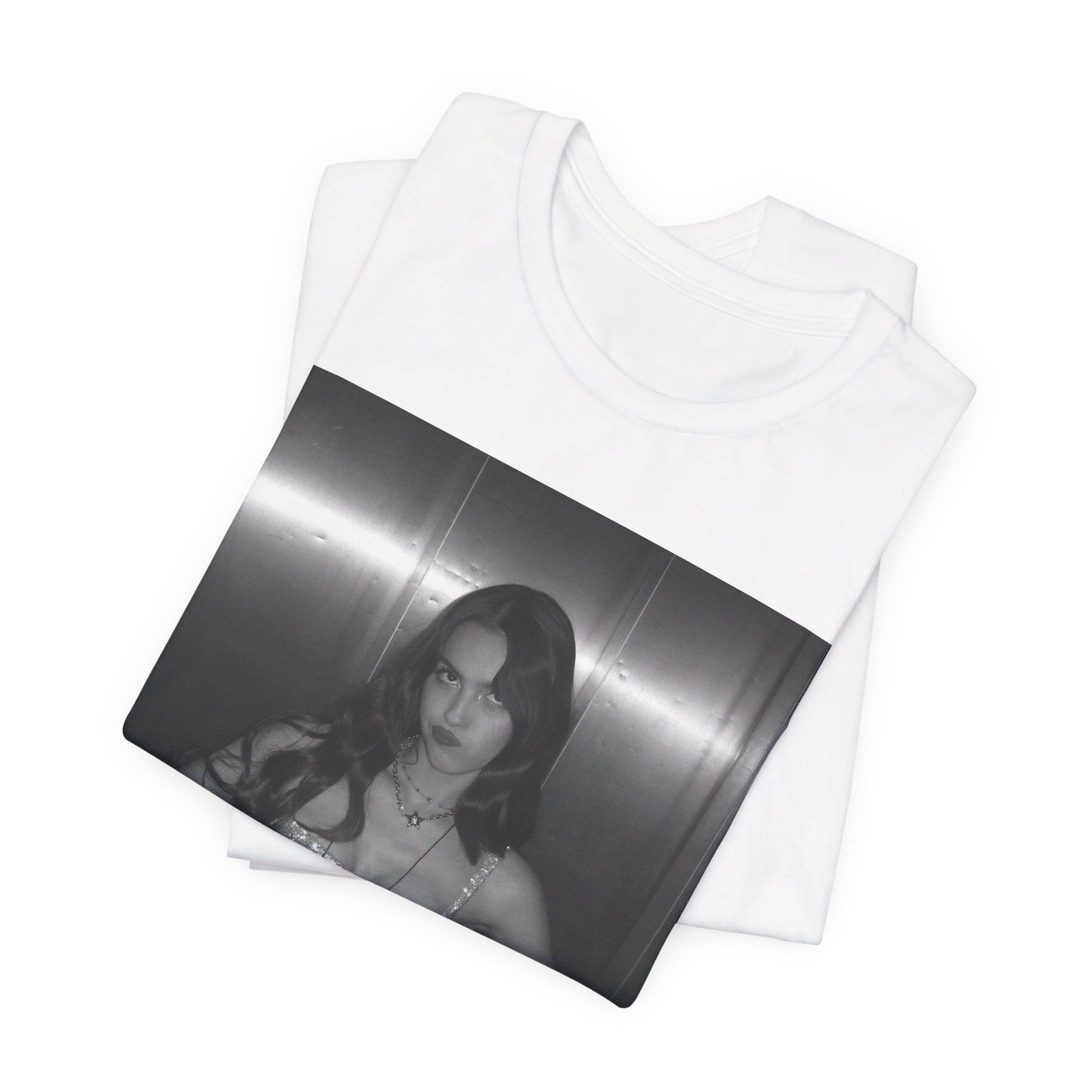 A black graphic t-shirt featuring a black and white portrait photo of Olivia Rodrigo.