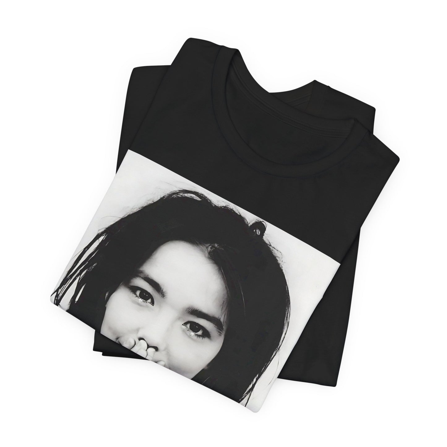 A black graphic t-shirt featuring a 90s black and white photographic portrait of Bjork.