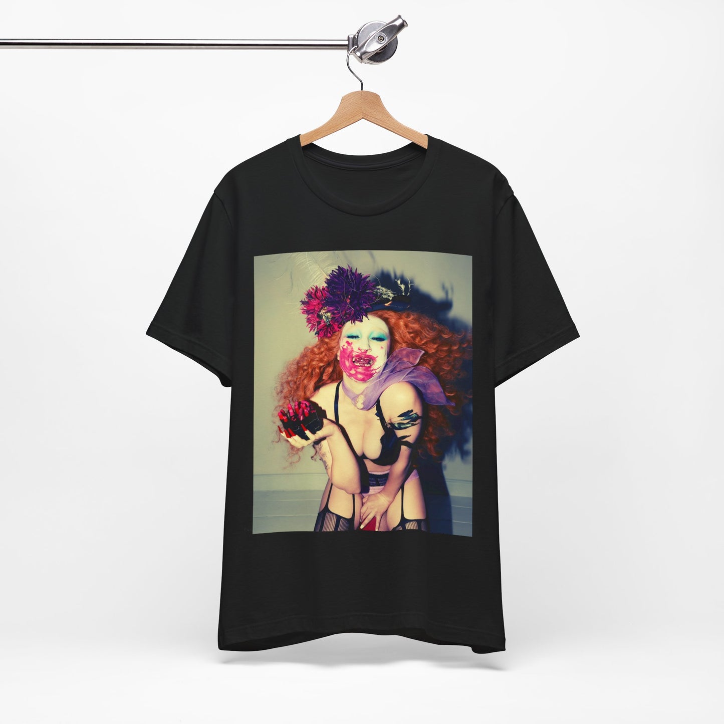 A black graphic t-shirt featuring a retro graphic related to Chappell Roan's 'Pink Pony Club' era.