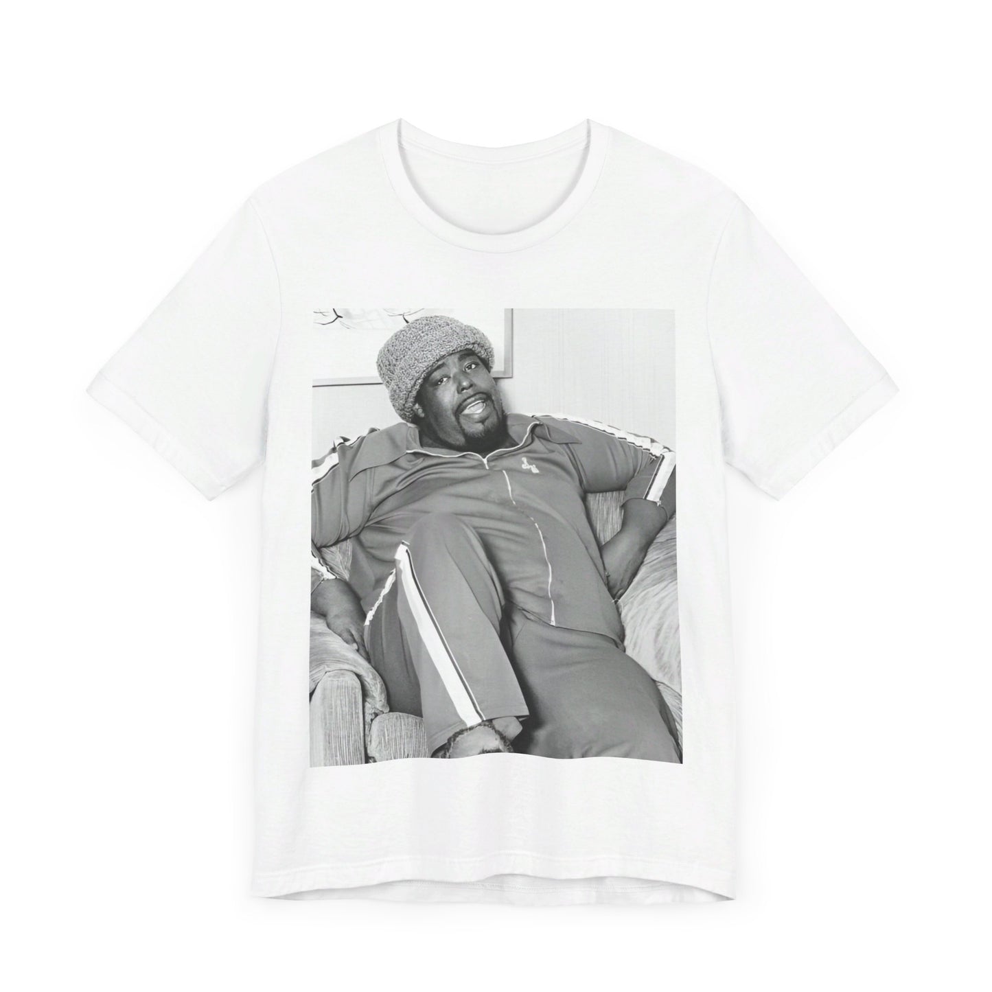 A black graphic t-shirt featuring a 70s-style portrait photo of Barry White in a lounge setting.