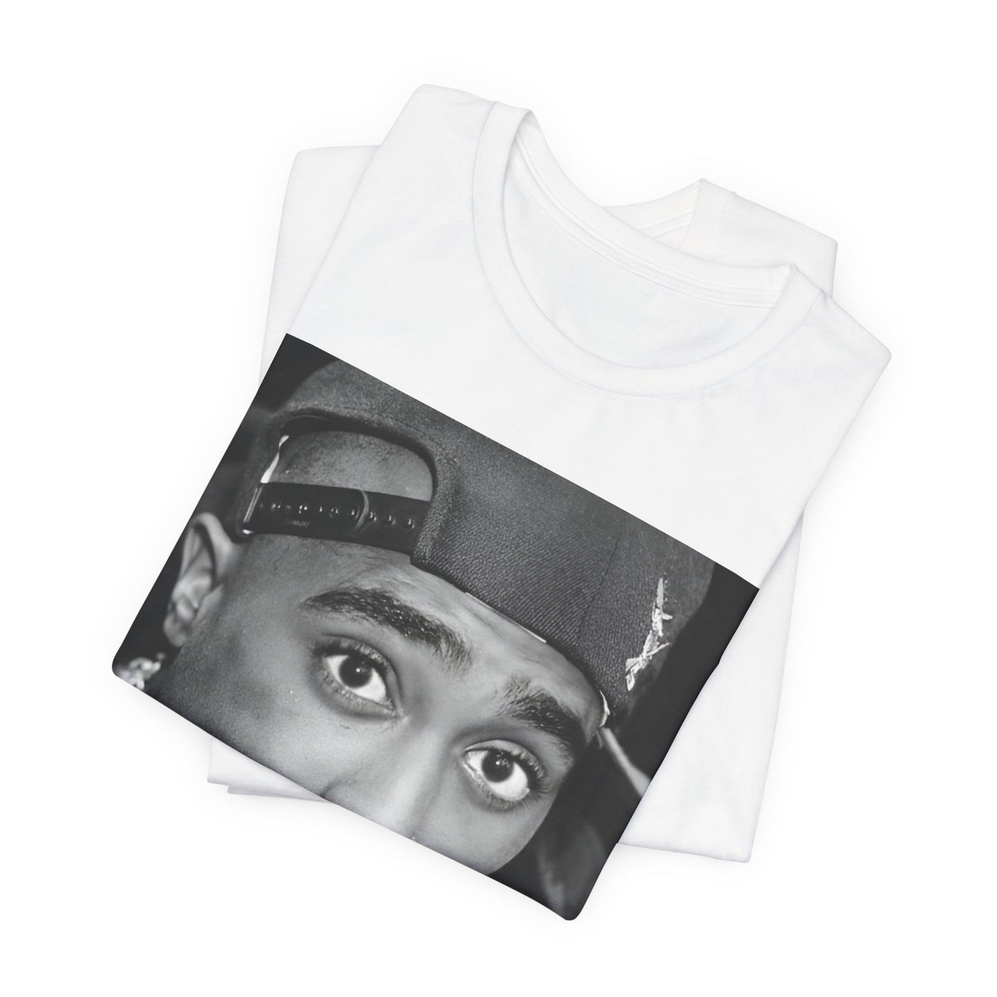A black graphic t-shirt featuring a bold graphic of Tupac as a rap superstar.