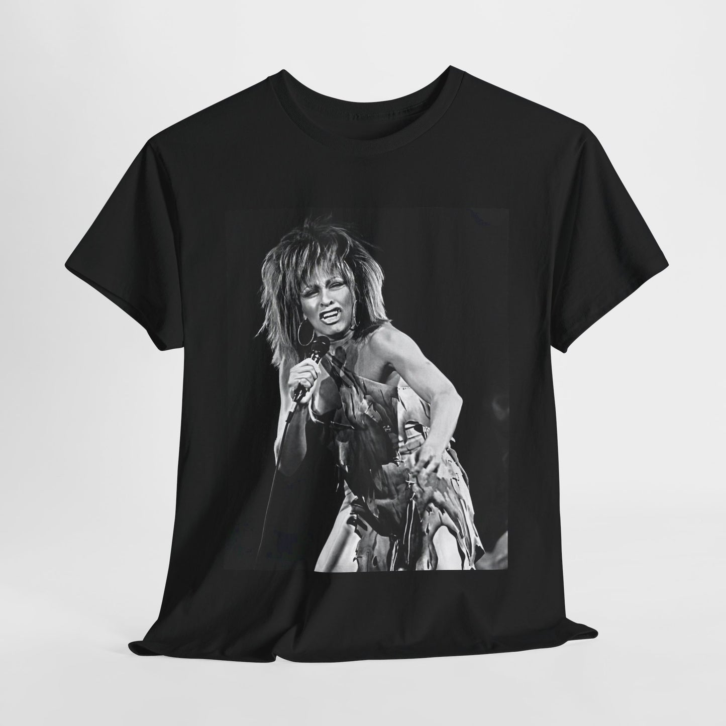 A black graphic t-shirt featuring a graphic of Tina Turner as an inspiring legend.